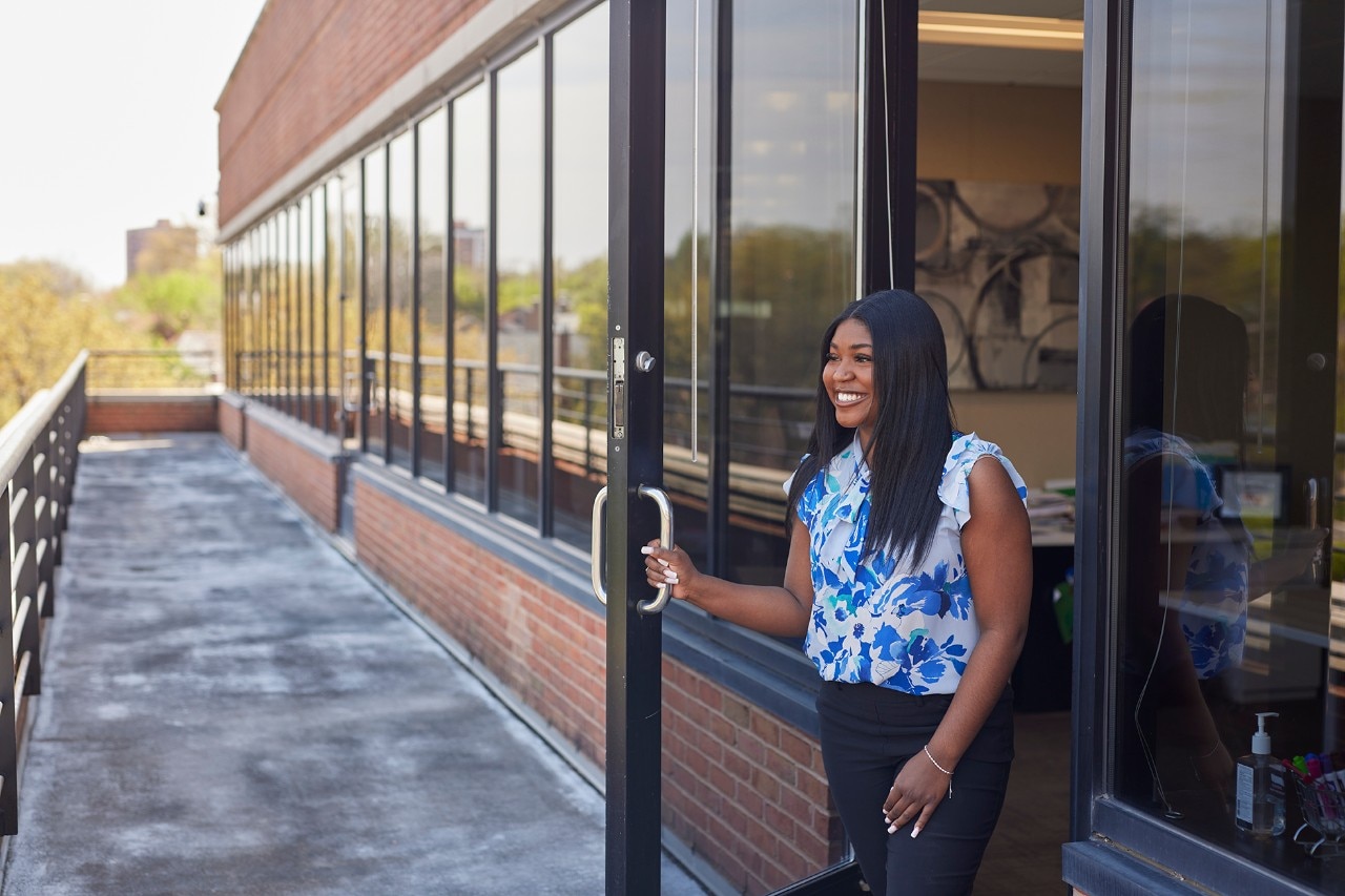 Enterprise Mobility team member opening a door at the St Louis, MO head office.