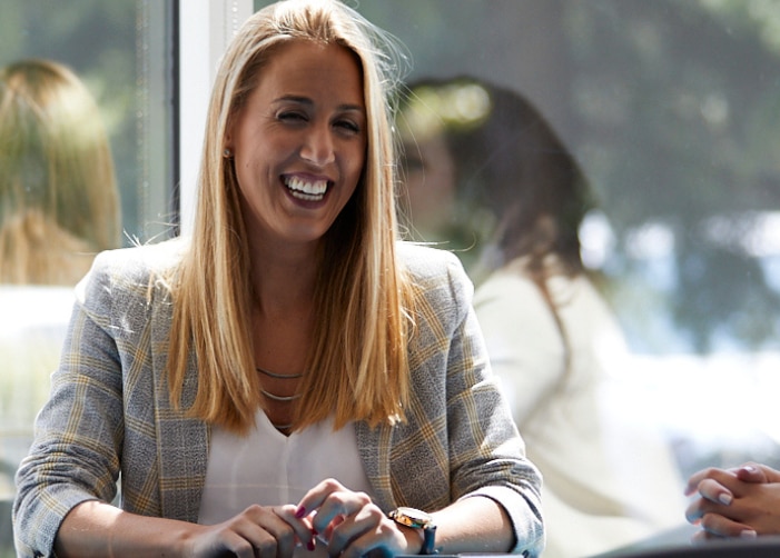 Two female coworkers sitting at a table