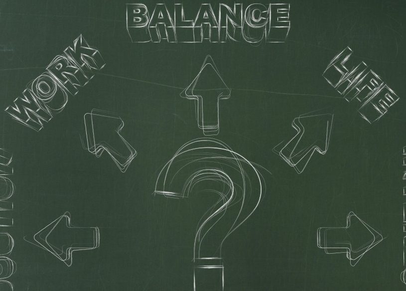 Chalkboard with question mark pointing toward work related words