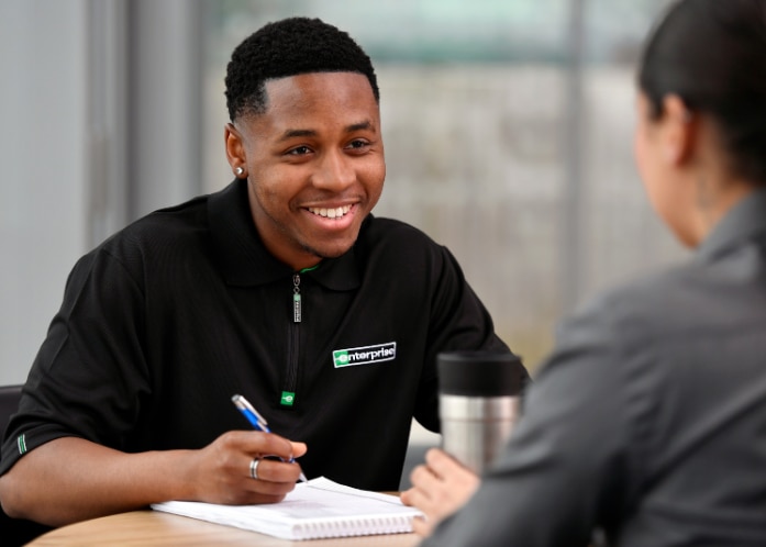 Man sitting on steps captioned "tips for using the STAR technique to answer interview questions"