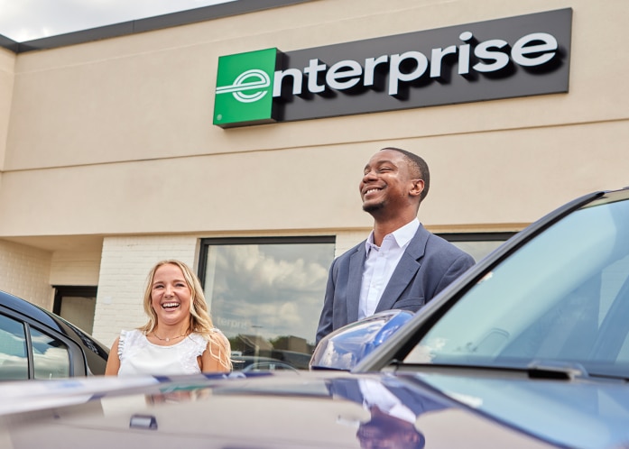 Two Enterprise Mobility employees laughing 