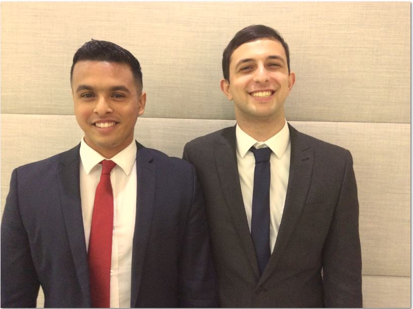Two Enterprise interns in suits