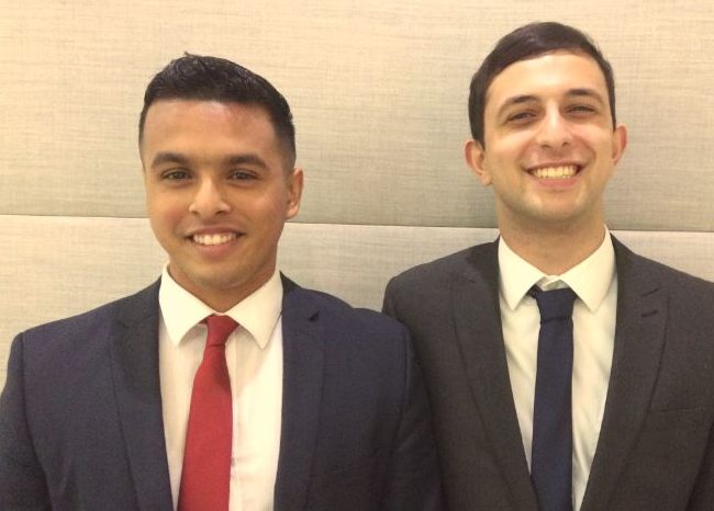 Two Enterprise interns in suits