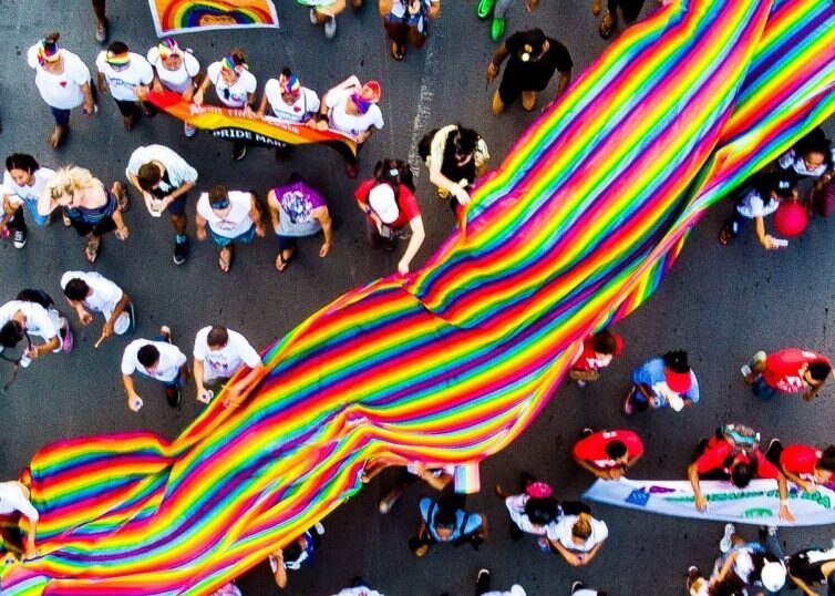 PRIDE Parade with large PRIDE flag