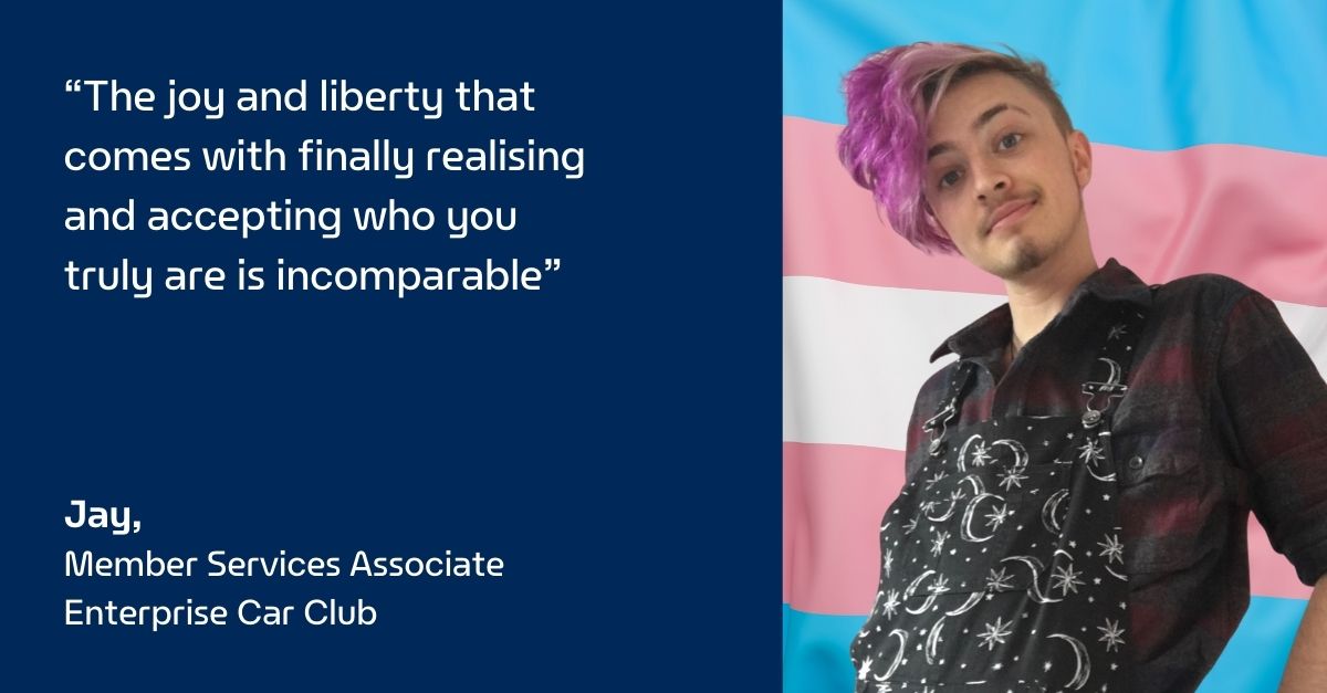 Picture of Jay in front of a blue, pink, and white flag with quote on blue background