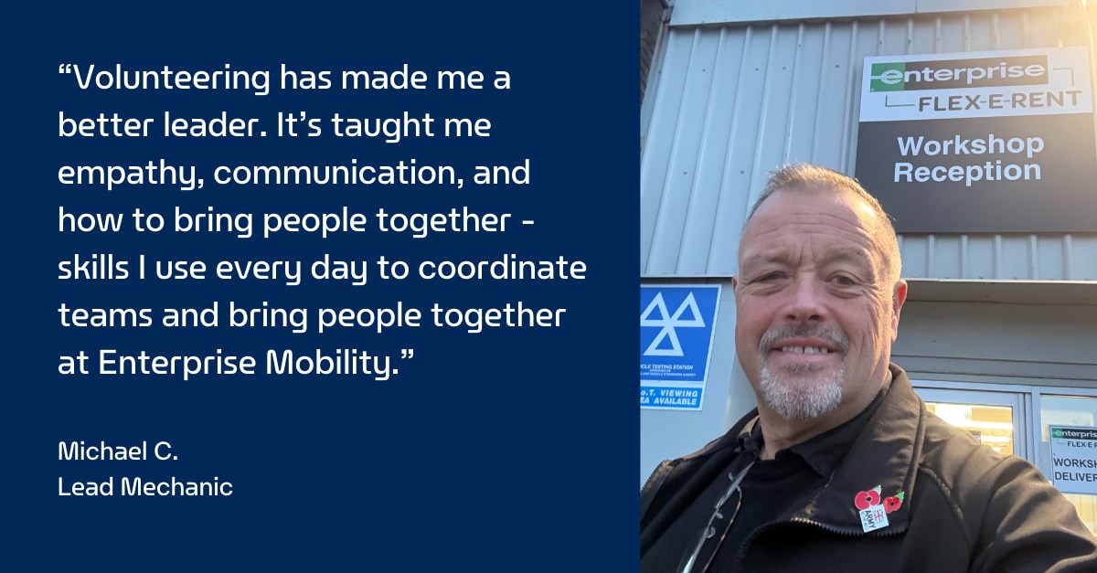 Enterprise Mobility Mechanic taking a selfie in front of Flex E Rent workshop