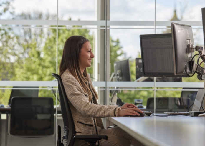 Female employee in a virtual interview on a computer