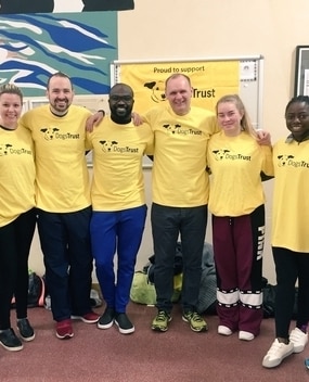 Employees in matching yellow shirts