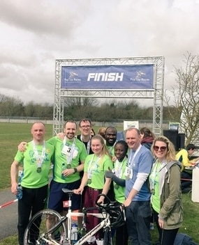 Employees at a finish line of a race