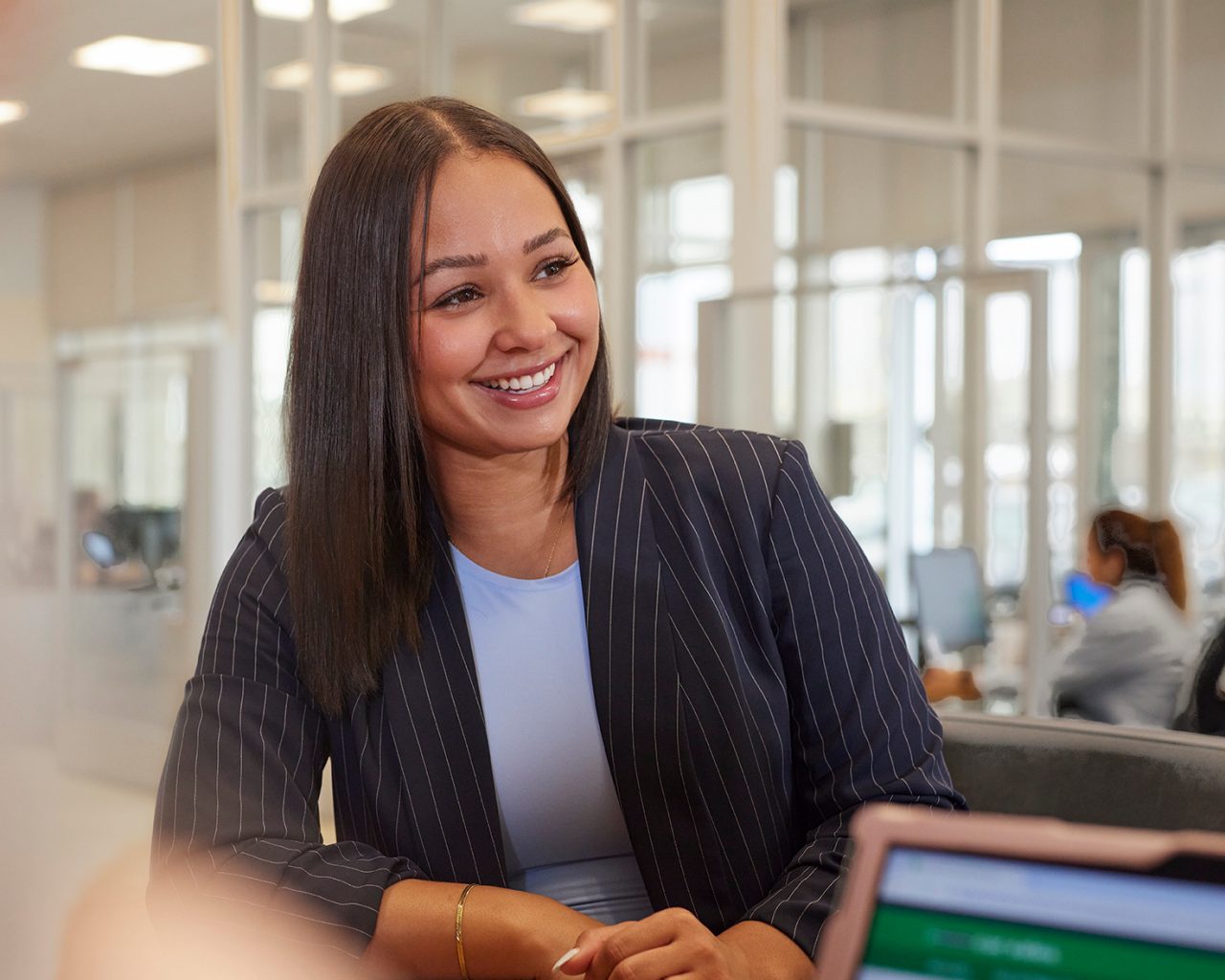 Female Enterprise Mobility employee at a meeting